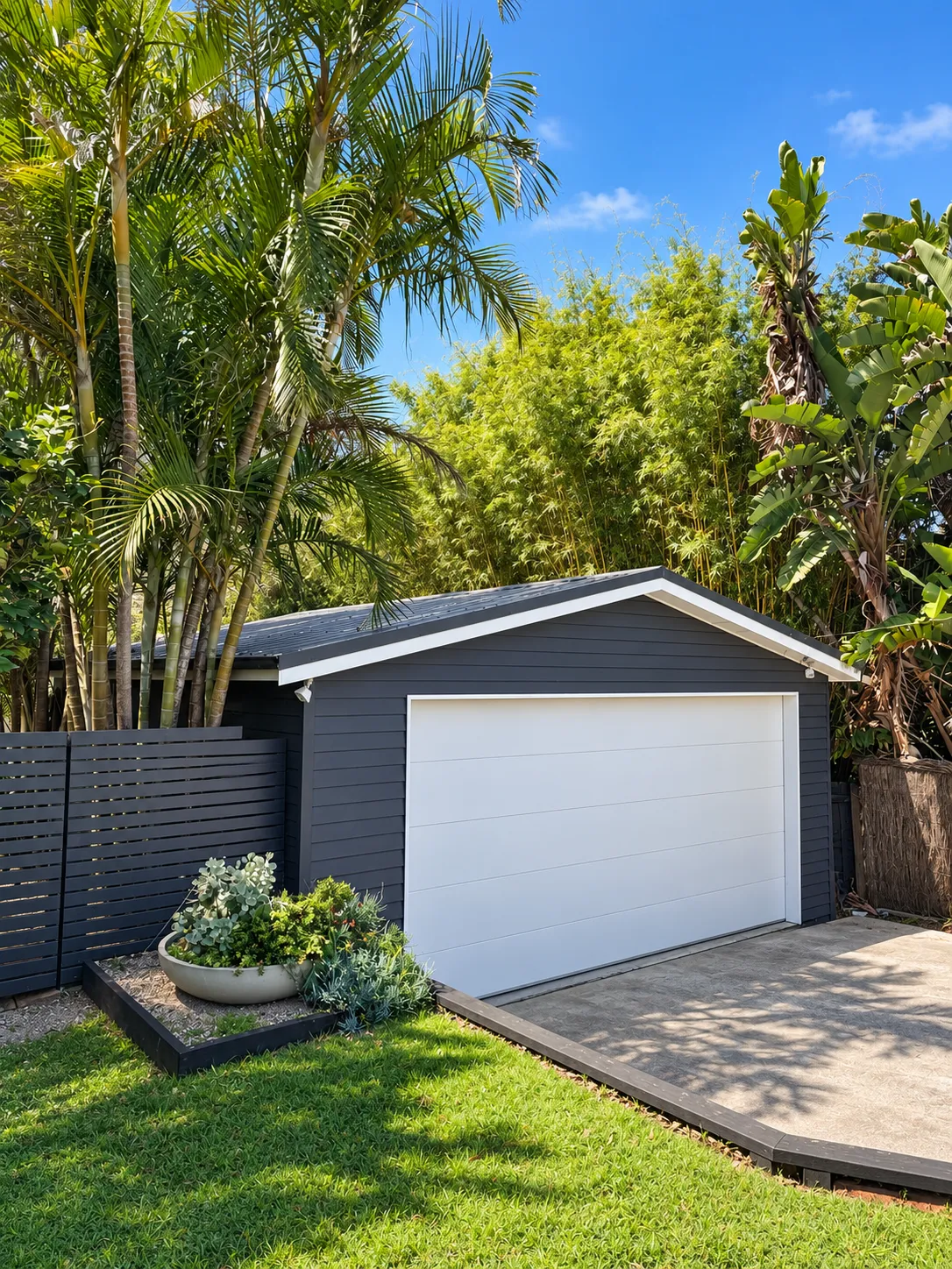 Dark garage with white door and timber deck path
