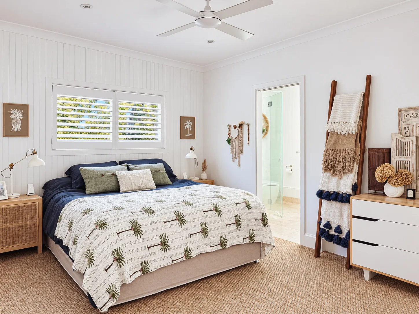 Bedroom with plantation shutters, woven furniture and ceiling fan
