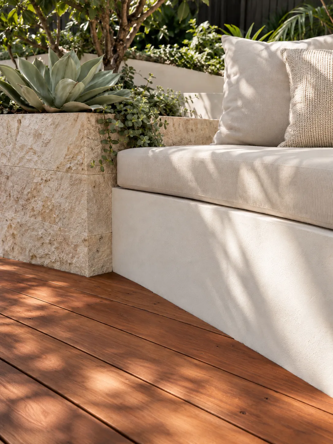 Sandstone planter and bench seat on a hardwood deck